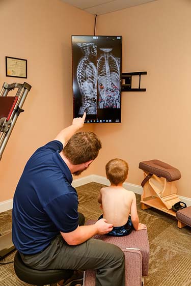 Chiropractor Signal Mountain TN Brandon Dial with Child and X-Ray